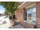 Brick building featuring an inviting entrance with glass door, showcasing a professional and accessible business location at 320 W Martin St # 205, Raleigh, NC 27601
