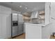 Well-equipped kitchen featuring stainless steel appliances, white cabinetry, and stylish backsplash at 320 W Martin St # 205, Raleigh, NC 27601