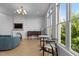 Stylish living room with herringbone flooring, fireplace, and abundant natural light at 320 W Martin St # 205, Raleigh, NC 27601