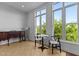 Bright, simple living area with large windows, and hardwood floors at 320 W Martin St # 205, Raleigh, NC 27601