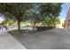 Expansive parking area bordered by lush trees and greenery, offering ample space and a pleasant environment at 320 W Martin St # 205, Raleigh, NC 27601
