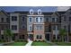 Charming townhome showcases a brick and siding exterior with well-maintained landscaping at 352 Chesapeak Commons St # 136, Garner, NC 27529