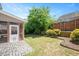 Backyard with patio, well-manicured lawn and partial fencing at 3566 Sunbright Ln, Raleigh, NC 27610