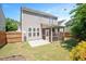 Fenced backyard featuring a screened porch and patio at 3566 Sunbright Ln, Raleigh, NC 27610
