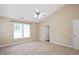 Large bedroom featuring a vaulted ceiling, a ceiling fan, and natural light from windows at 3566 Sunbright Ln, Raleigh, NC 27610