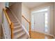 Inviting foyer with staircase and natural light at 3566 Sunbright Ln, Raleigh, NC 27610