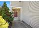 Welcoming front entrance with covered porch and vibrant landscaping at 3566 Sunbright Ln, Raleigh, NC 27610