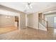 Spacious living room with hardwood floors, ceiling fan and access to foyer at 3566 Sunbright Ln, Raleigh, NC 27610