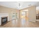 Open living room with fireplace, sliding glass doors and tile floors at 3566 Sunbright Ln, Raleigh, NC 27610