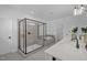 Bright bathroom features modern shower, soaker tub, double vanity, and tile flooring at 386 The Parks Dr, Pittsboro, NC 27312