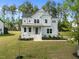 Beautiful two-story home with a well-manicured lawn and inviting front porch at 386 The Parks Dr, Pittsboro, NC 27312