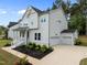 Gorgeous home with a two-car garage, black mulch, and a driveway at 386 The Parks Dr, Pittsboro, NC 27312