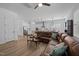 Spacious living room with a leather sectional and open layout to the kitchen at 386 The Parks Dr, Pittsboro, NC 27312