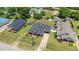Aerial view of a well-maintained home featuring a black roof and a cozy front porch at 404 W E St, Erwin, NC 28339