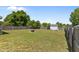 Spacious backyard featuring a well-maintained lawn and a sturdy wooden fence for privacy at 404 W E St, Erwin, NC 28339