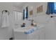 Bathroom featuring a vanity, tiled walls, and a mirror, providing a functional and clean space at 404 W E St, Erwin, NC 28339