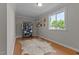 Bedroom with natural light, wood floors, and a minimalist design at 404 W E St, Erwin, NC 28339