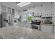 Bright kitchen featuring stainless steel appliances, granite countertops and white cabinetry at 404 W E St, Erwin, NC 28339