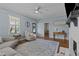 Inviting living room with hardwood floors, blue walls, and a view of the front door and adjacent rooms at 404 W E St, Erwin, NC 28339