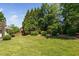 Well-maintained backyard with lush greenery and privacy landscaping at 4404 Yadkin Dr, Raleigh, NC 27609