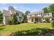 Expansive backyard features a covered patio, lush lawn, and mature landscaping at 4404 Yadkin Dr, Raleigh, NC 27609
