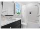 Traditional bathroom featuring dark-stained vanity with white countertop, and a shower and tub combo at 4404 Yadkin Dr, Raleigh, NC 27609