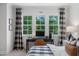 Cozy bedroom featuring a study area by the windows with checkered curtains and plaid comforter at 4404 Yadkin Dr, Raleigh, NC 27609
