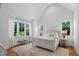 Bright bedroom featuring a large window and natural light with plush carpet at 4404 Yadkin Dr, Raleigh, NC 27609
