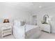 Bright bedroom with a classic white wooden bed frame and a ceiling fan at 4404 Yadkin Dr, Raleigh, NC 27609