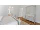Bright bedroom features hardwood floors and a charming antique wardrobe at 4404 Yadkin Dr, Raleigh, NC 27609