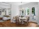 Bright breakfast nook with white walls, built-in bench, and light fixture near windows at 4404 Yadkin Dr, Raleigh, NC 27609