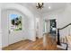 Welcoming foyer with hardwood floors, grand entry door, and views into the home's other living spaces at 4404 Yadkin Dr, Raleigh, NC 27609