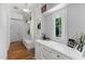 Bright hallway features custom built-ins, white cabinetry, and natural light streaming through the window at 4404 Yadkin Dr, Raleigh, NC 27609