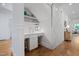 Hallway nook with a sink, white cabinetry, and a unique sliding door, offering both style and functionality at 4404 Yadkin Dr, Raleigh, NC 27609