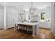 Gourmet kitchen with a large island, pendant lights, and hardwood floors at 4404 Yadkin Dr, Raleigh, NC 27609