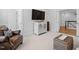 Comfortable living room with neutral carpet and decor at 4404 Yadkin Dr, Raleigh, NC 27609