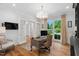 Office featuring hardwood floors, a classic desk, and French doors providing a view of the front yard at 4404 Yadkin Dr, Raleigh, NC 27609