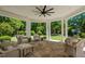 Covered outdoor living space with stone floor and comfortable wicker seating at 4404 Yadkin Dr, Raleigh, NC 27609