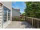 View from the large back deck showing the yard, neighboring home, and surrounding trees at 4725 Parr Vista Ct, Raleigh, NC 27612