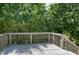 Spacious, partially shaded back deck overlooking mature trees provides privacy at 4725 Parr Vista Ct, Raleigh, NC 27612