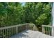 View of the spacious back deck with mature trees providing shade and privacy at 4725 Parr Vista Ct, Raleigh, NC 27612
