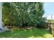 Lush backyard features a large, mature tree, providing ample shade and a serene outdoor space at 4725 Parr Vista Ct, Raleigh, NC 27612