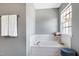 Cozy bathroom featuring a soaking tub and fresh towels on a rack at 4725 Parr Vista Ct, Raleigh, NC 27612