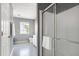 Bathroom featuring a glass shower door and a view to a toilet and sink at 4725 Parr Vista Ct, Raleigh, NC 27612