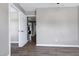 Bedroom featuring hardwood floors and a doorway to another bedroom at 4725 Parr Vista Ct, Raleigh, NC 27612