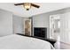 Bedroom featuring a ceiling fan and view to an en-suite bathroom and hallway at 4725 Parr Vista Ct, Raleigh, NC 27612