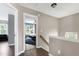 Upstairs hallway showcasing access to bedroom with lots of natural light at 4725 Parr Vista Ct, Raleigh, NC 27612