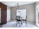 Bright eat-in kitchen with a granite table, chandelier lighting, tile flooring, and stainless steel appliances at 4725 Parr Vista Ct, Raleigh, NC 27612
