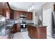 Contemporary kitchen with pendant lighting, stainless steel appliances, and center island at 4725 Parr Vista Ct, Raleigh, NC 27612