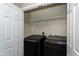 Laundry room with washer, dryer, and shelving at 4725 Parr Vista Ct, Raleigh, NC 27612